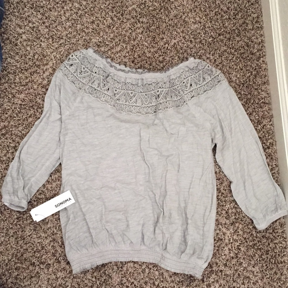 Long sleeve, off the shoulder shirt.